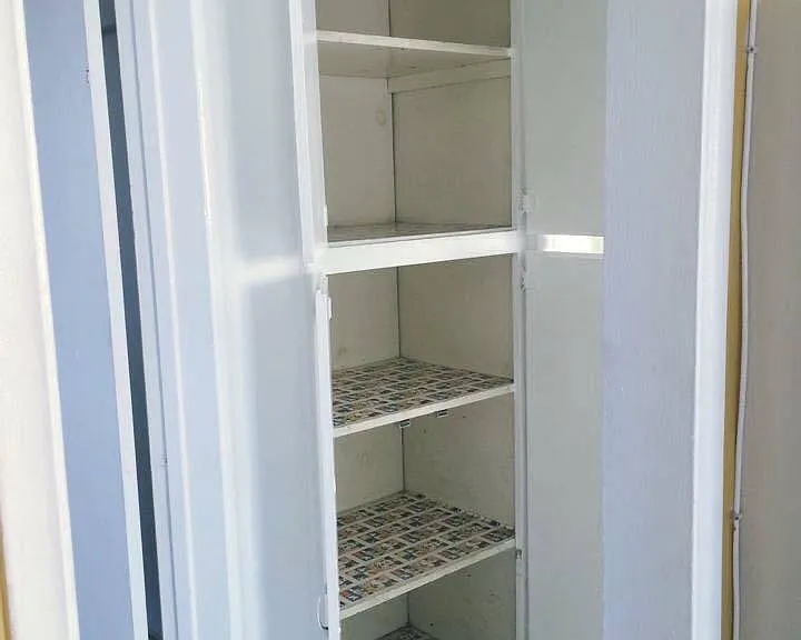 Linen space between bedroom and bath.