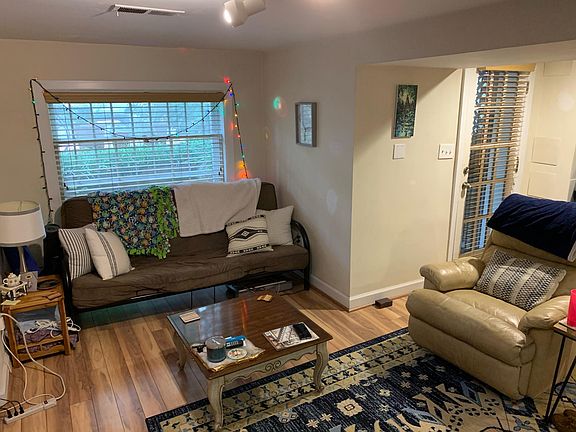 Living room nook with large front window.