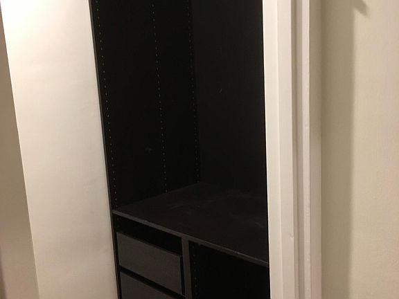 walk in closet with shelving