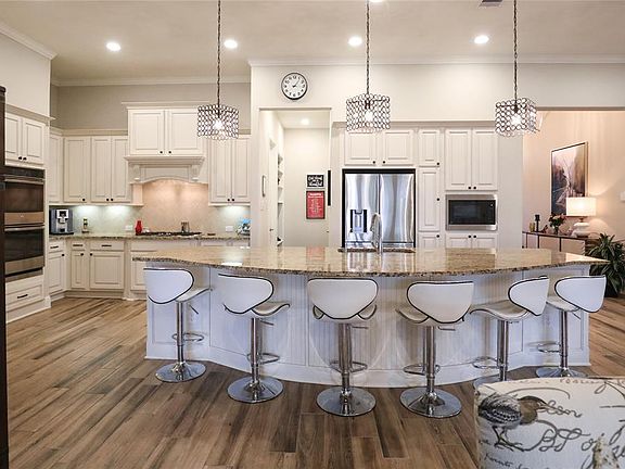 LOTS OF STORAGE, HIGH CEILINGS, DESIGNER PENDANT LIGHTS FROM ARHAUS WILL STAY.