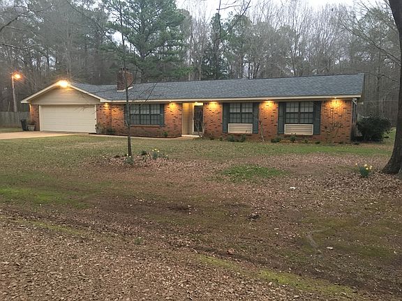 House from driveway at dusk