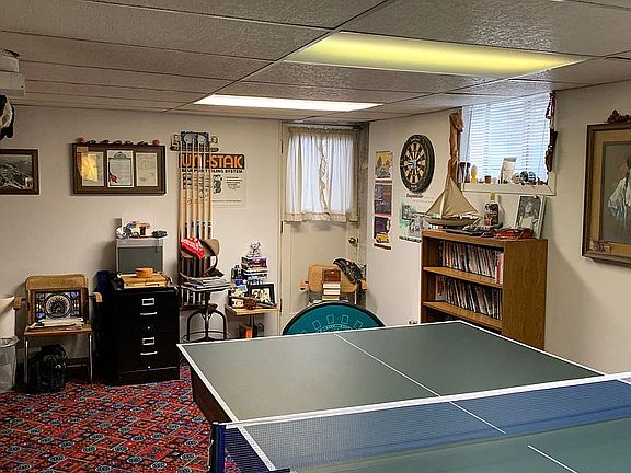 Basement with pool table/pin