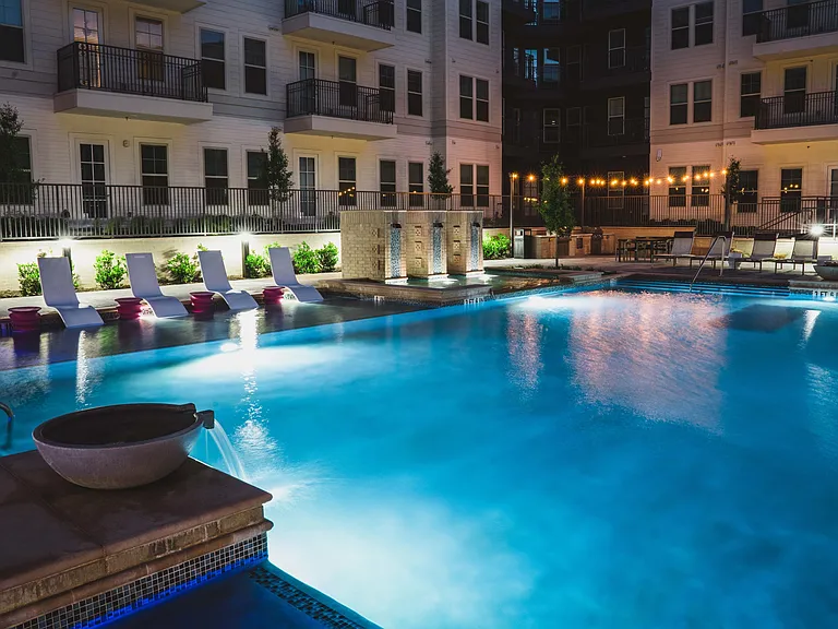 Night view of resort-style pool