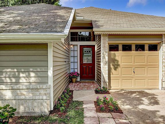 A welcoming front door and brick entry.