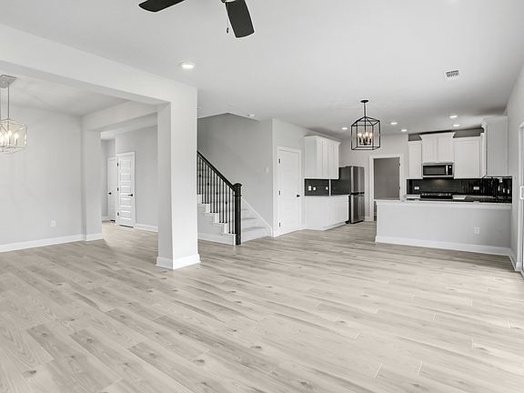 Open-concept layout with spacious living areas.