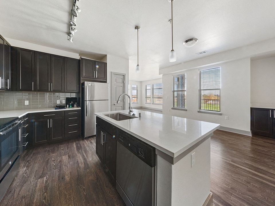 Newly renovated kitchens- featuring luxury quartz islands, custom cabinetry, and stainless steel appliances