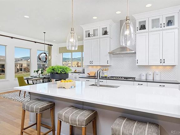 Open luxury kitchen with granite countertops and gas cooktop