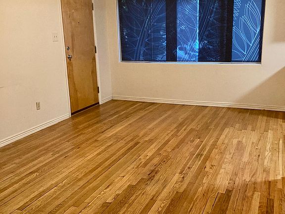 Living area with beautiful hardwood floors.