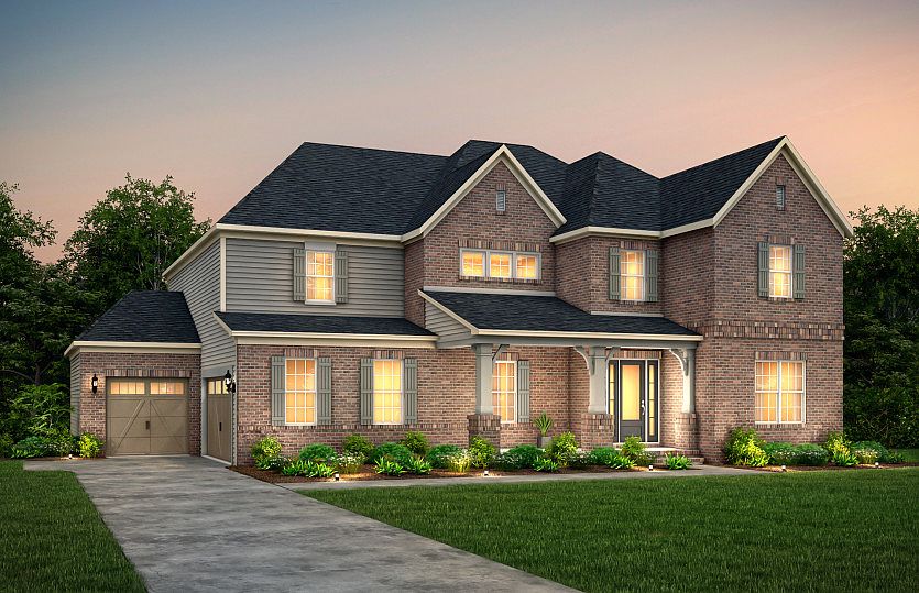 Fearington Exterior 22 features brick, hardie siding, covered front porch and 3 car sideload garage