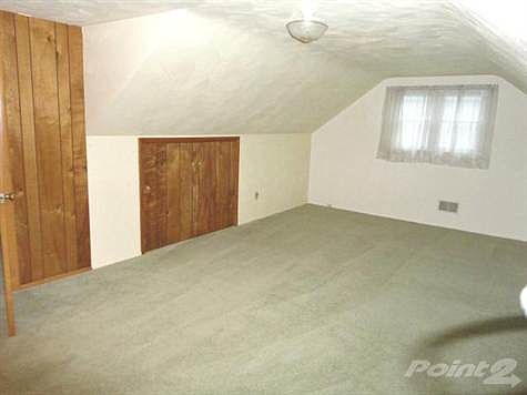 One of the upper bedrooms with walk-in closet.