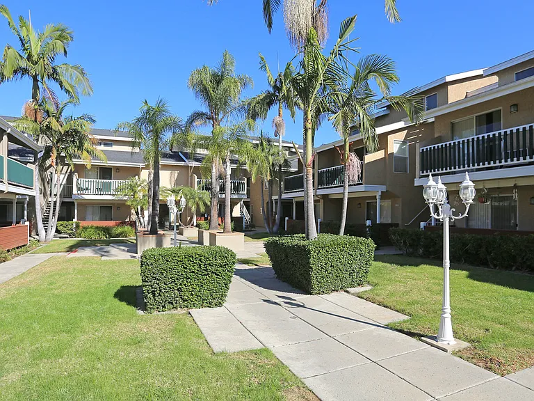 Full courtyard view with landscape and enclosing buildings