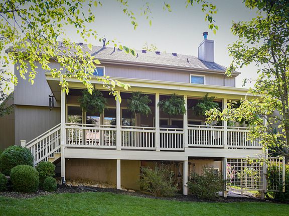 Covered deck overlooks yard