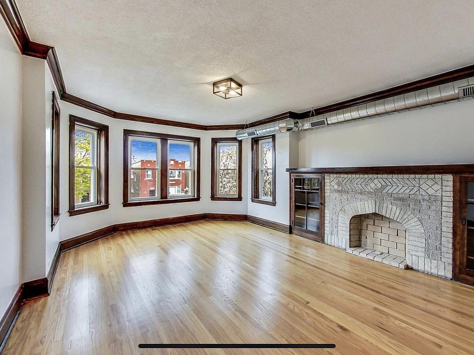 Living room, which looks out onto a quiet street. In the spring, a gorgeous Magnolia blooms in the neighbor's yard.