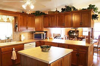 Simply beautiful! The new custom kitchen is the heart of this open floor plan and features a terrific view of the lake.