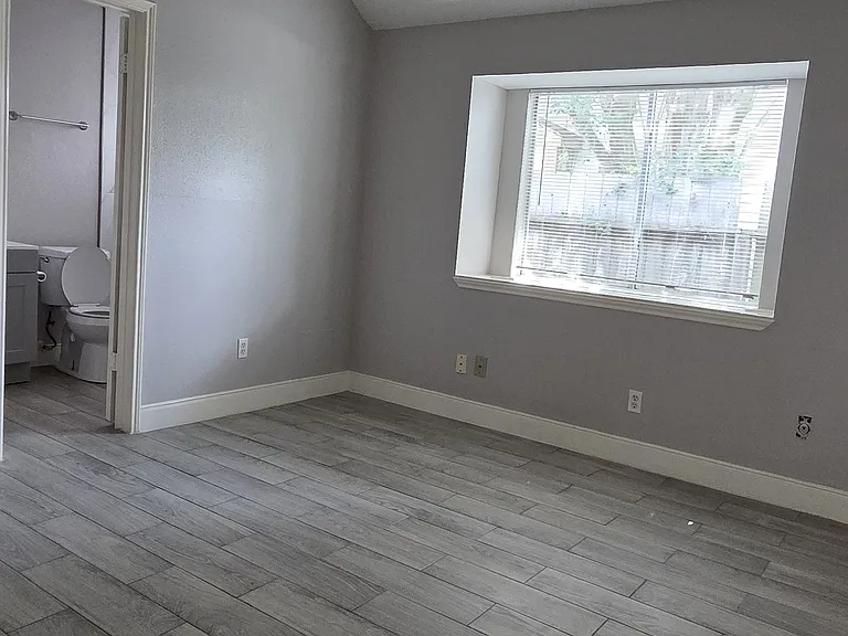 The primary bedroom also comes with high ceilings.