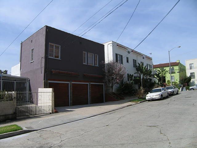 North elevation of the property along West 2nd Street Carriage House and three garages beneath at street level
