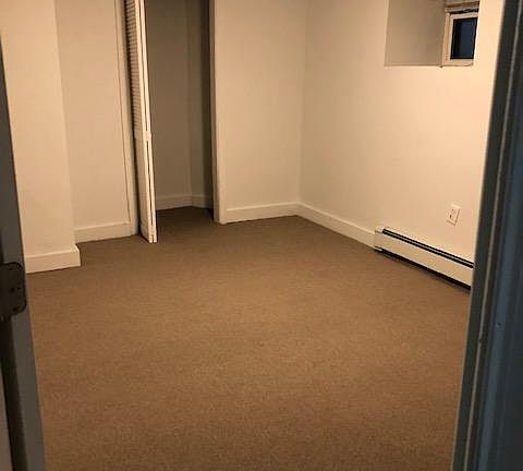 view of bedroom on lower level of apartment