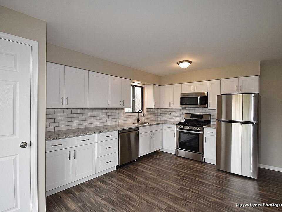 New Kitchen Cabinets with Stainless Appliances, Granite, and Backsplash