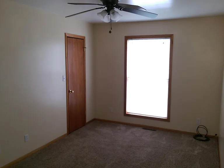 Main bedroom view towards walk-in closet door
