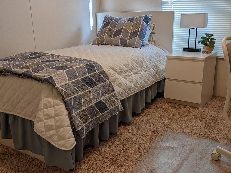 Bed in twin bed room (Blackout curtains were added after this photo was taken)