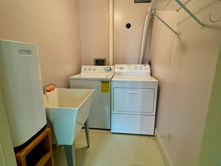 Laundry room with utility sink and dehumidifier
