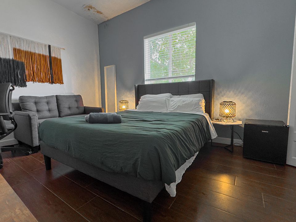 Queen bed with mini fridge and 4K Smart TV