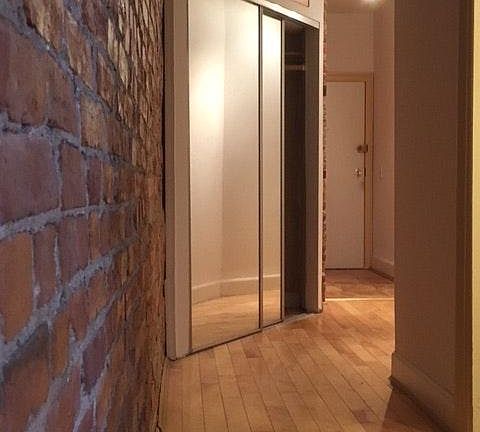 Entryway w exposed brick wall