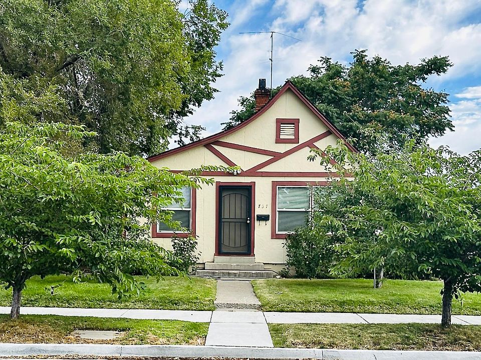Front of home with apple, cherry and peach trees!