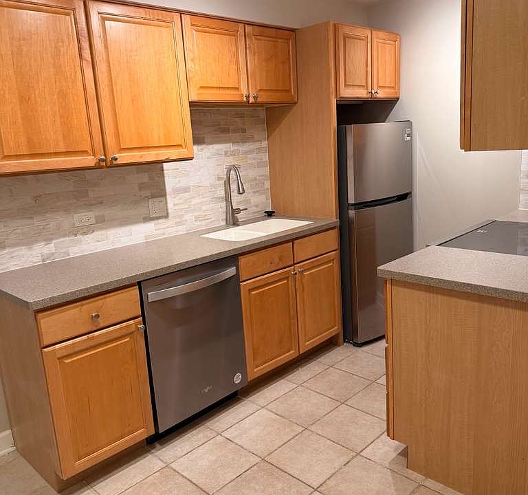 Kitchen with fridge and dishwasher