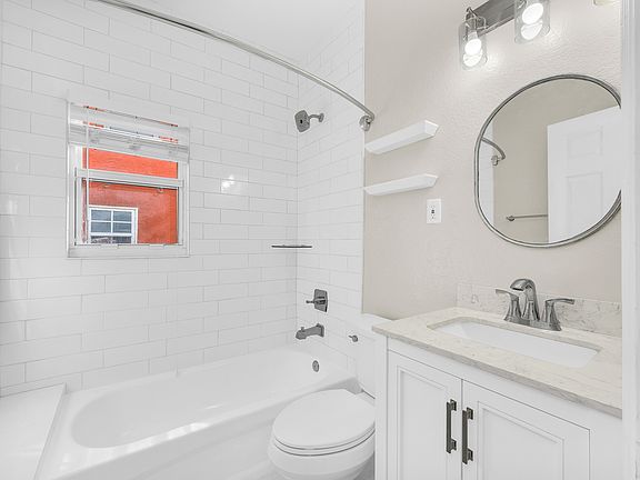 brand new renovated bathroom with large recessed medicine cabinet