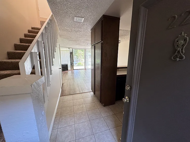 Entry way (access to second floor on the left, kitchen and living space to right)