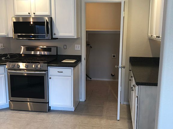 Door to large pantry/laundry