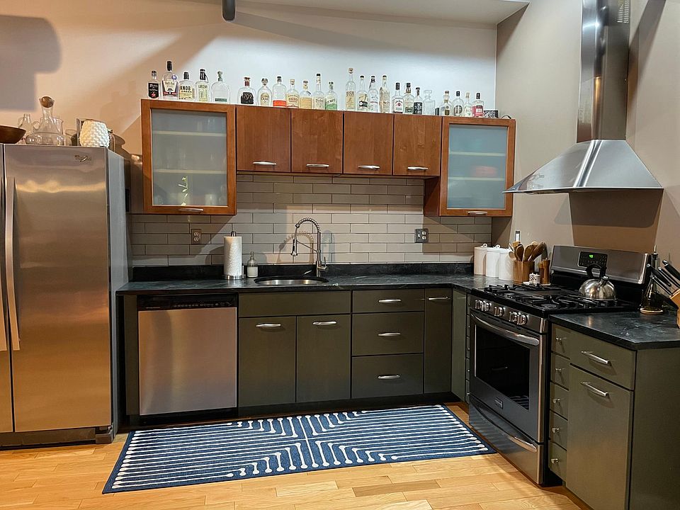 Kitchen with gas stove and soapstone countertops