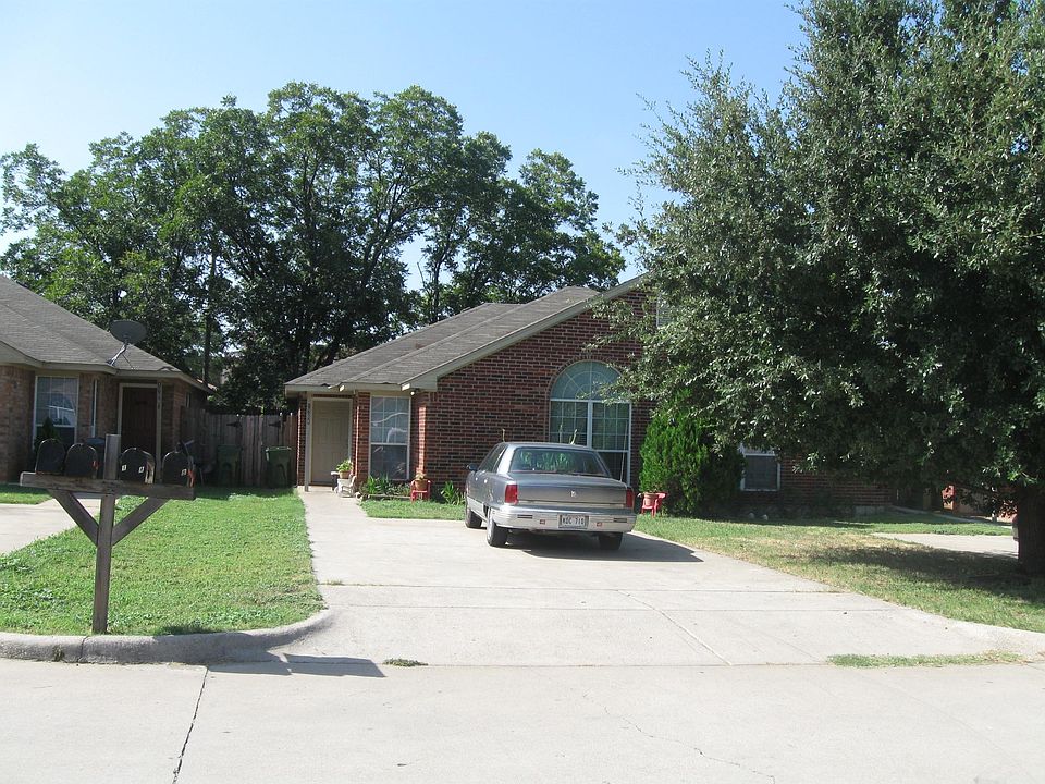 Front of t, 3Property 4 car tree shaded parking.