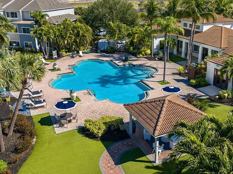 Take in the breathtaking aerial view of our beautifully landscaped pool area, designed for ultimate comfort.