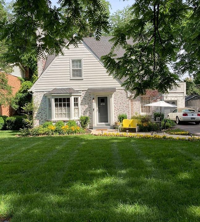 Parking and entrance to the right of the home.