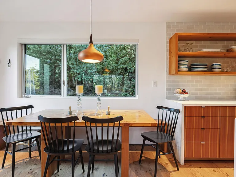 Kitchen/ dining area looks out to backyard area.