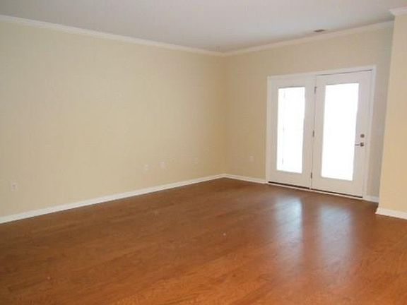 Living room with access to outside deck and storage