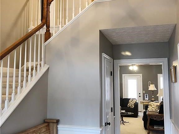 Grand foyer with hardwood floors