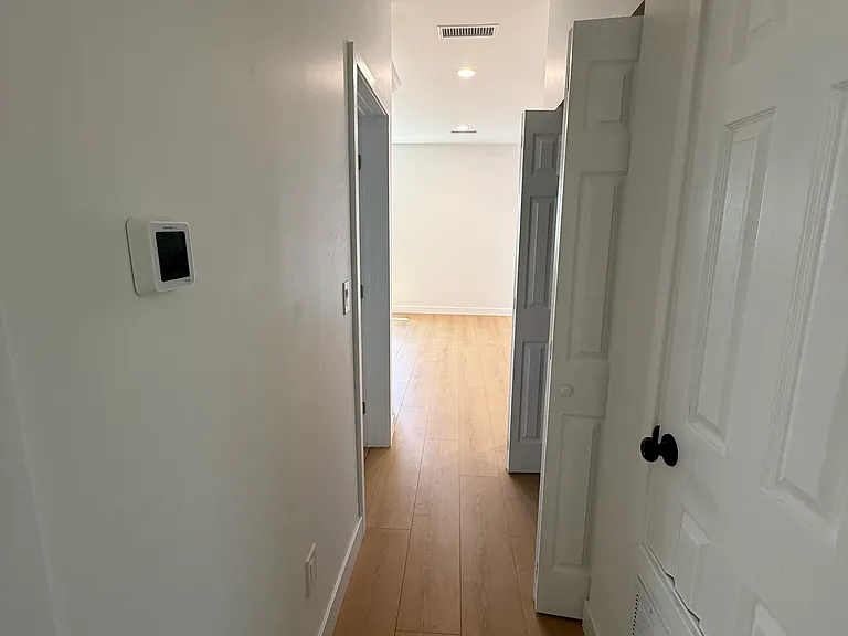 Looking from bedrooms down hall to front room
