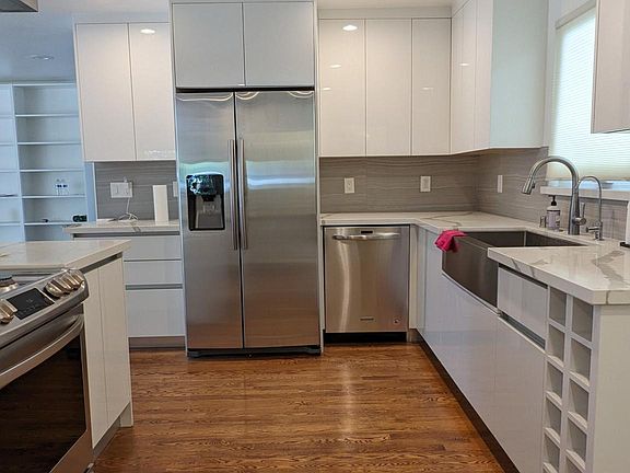 Custom cabinetry. Original hardwood floor.