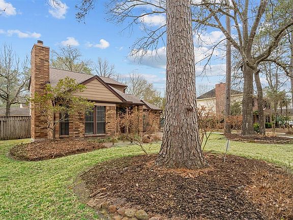 Large, mature trees add to the beauty of the home and this neighborhood.
