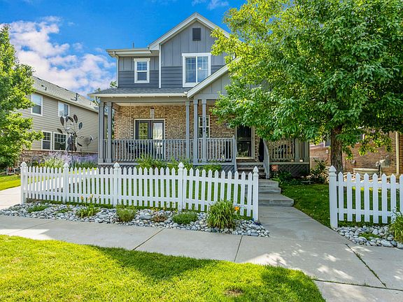 Darling front porch, white picket fence neighborhood