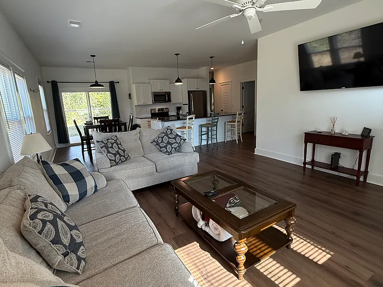 large, comfy couches and 70" Smart TV