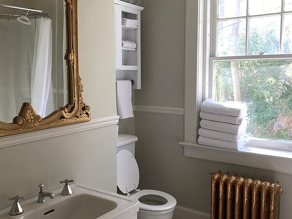 Bathroom with marble floor and original 1912 sink