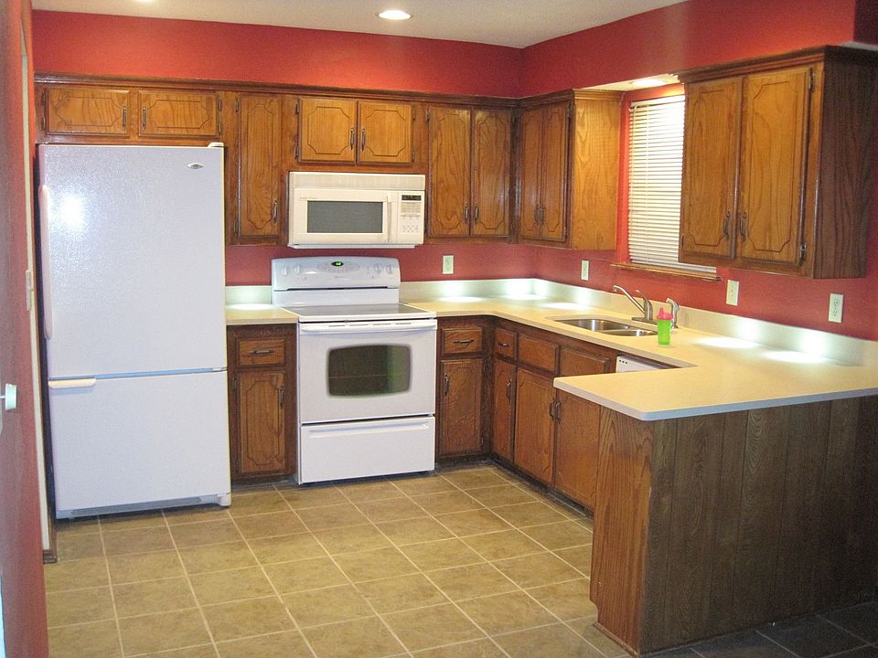 The kitchen has new flooring and countertops.