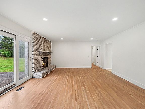 den with hallway leading to bedrooms