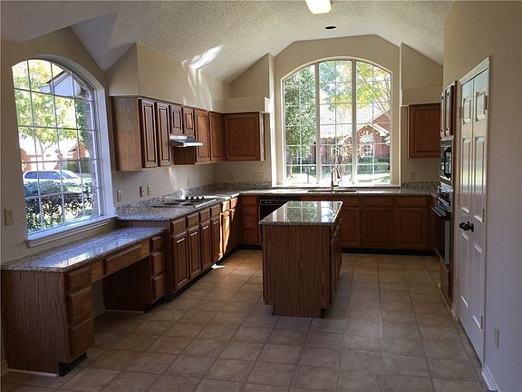 Huge kitchen has a large double pantry (at right).