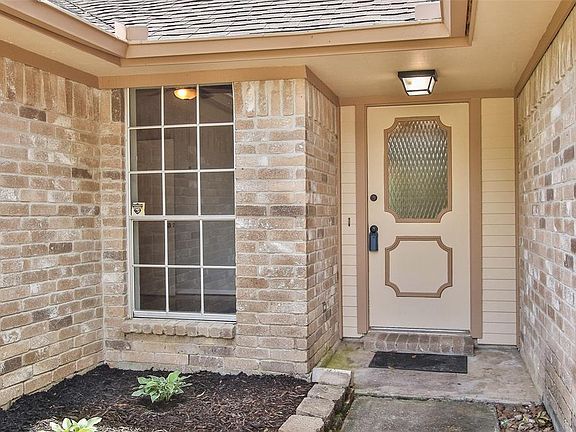 Approaching the beautiful front door you will notice the beautiful brick elevation, and a lovely landscaping.