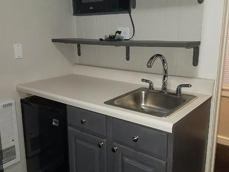 Close up of Mini Kitchen - complete with Sink, Microwave & Counter High Frig